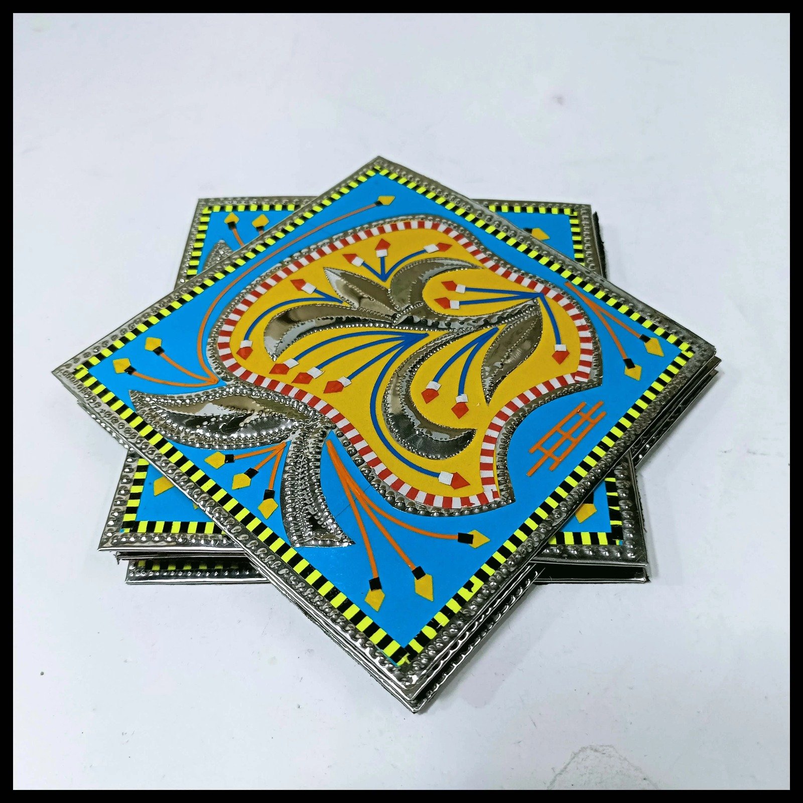 Side view of stacked blue truck art coasters