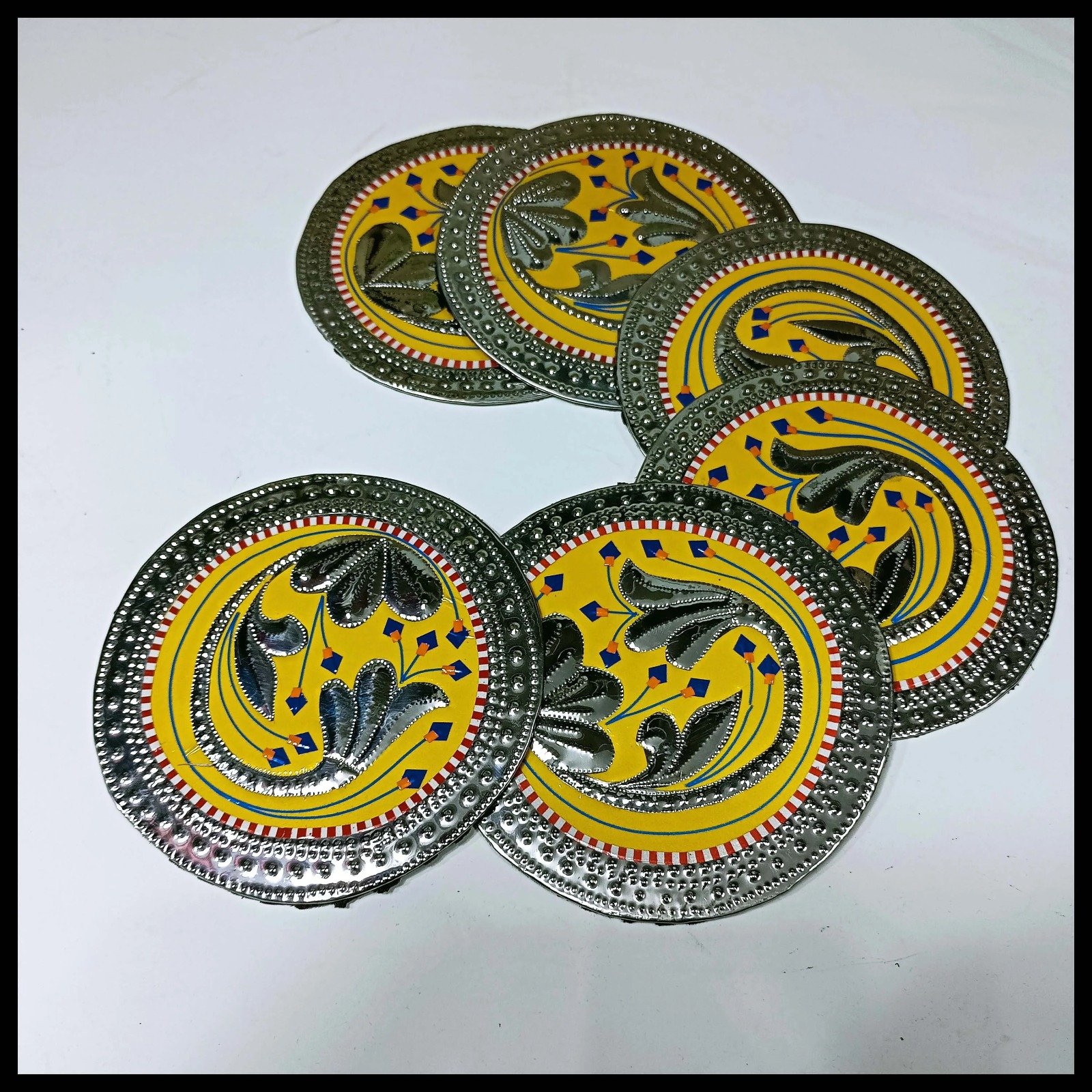 Six Yellow Chamakpatti coasters in fan display