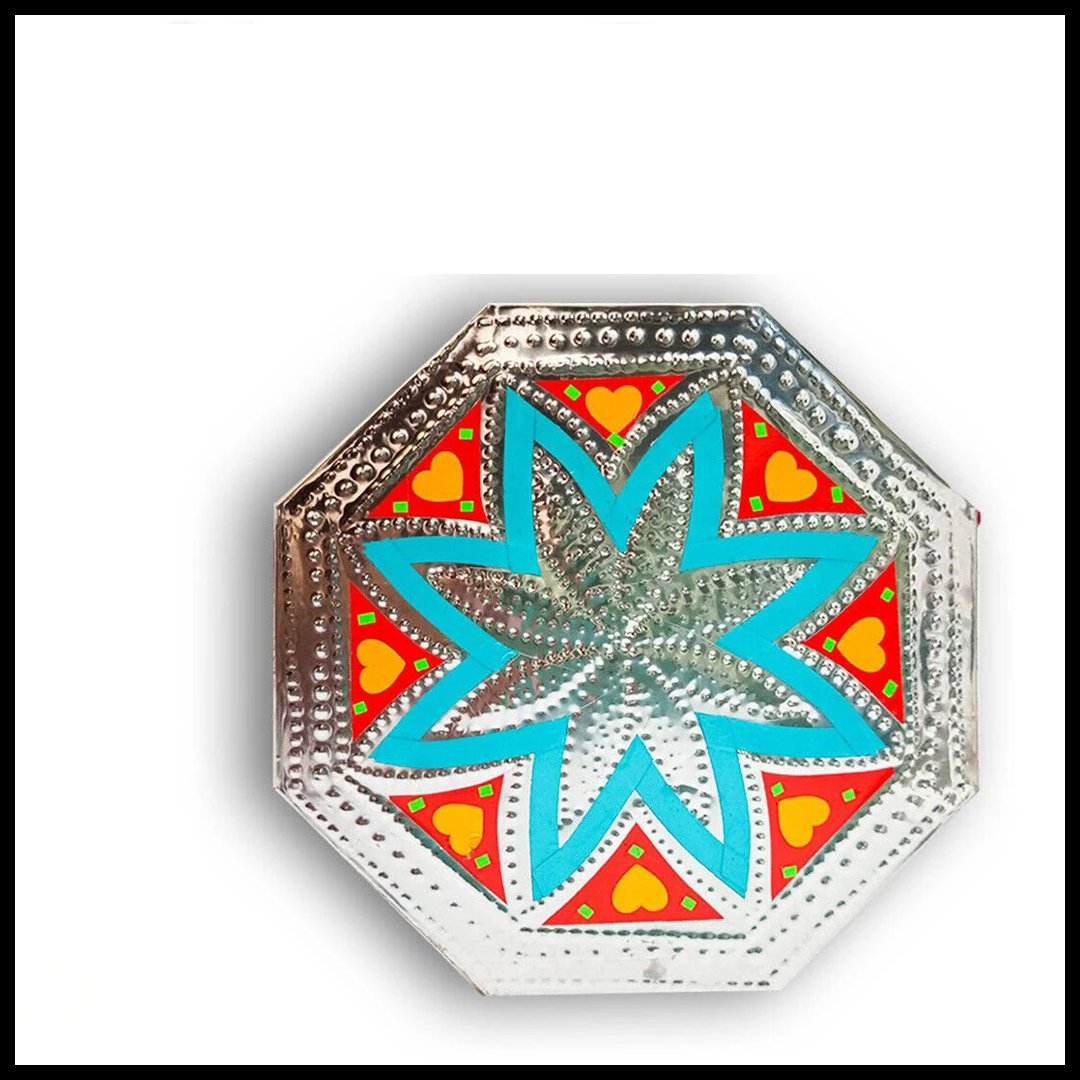 "Faded silver chamakpatti coaster with floral truck art pattern"